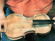 Gerry shows how thin sides are fitted on a violin body!